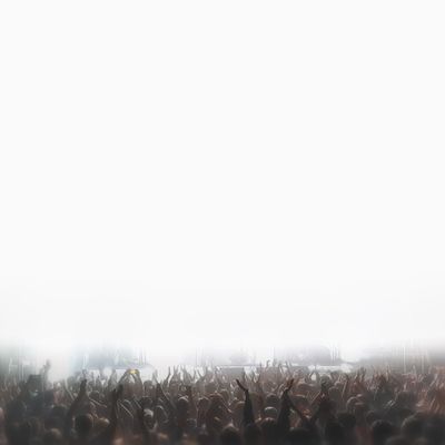 Crowd cheering energetically at a concert or event.