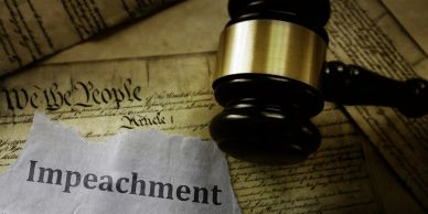Gavel, impeachment paper, and Constitution.