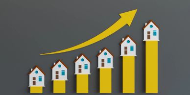 Graph showing rising home values with upward arrow.