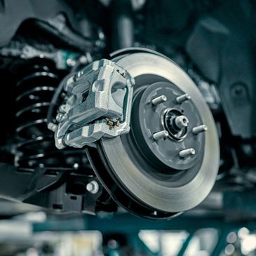 Close-up of a car brake disc and caliper.
