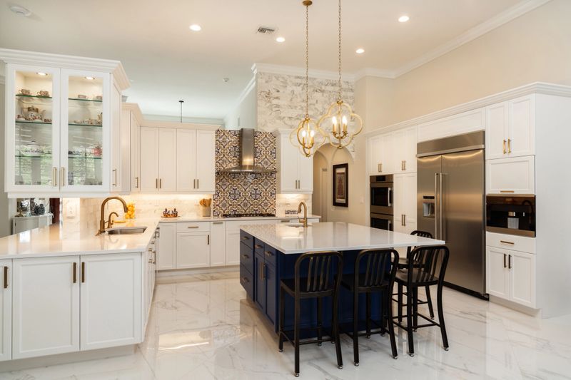 Beautiful luxury estate home kitchen with white cabinets.