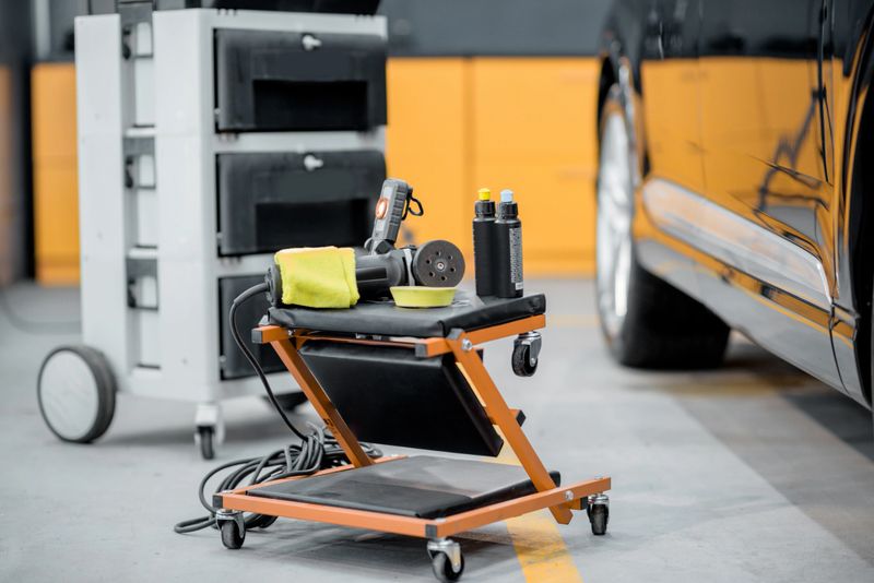 Professional equipment for automotive body polishing at the car service. Car detailing tools for vehicle care