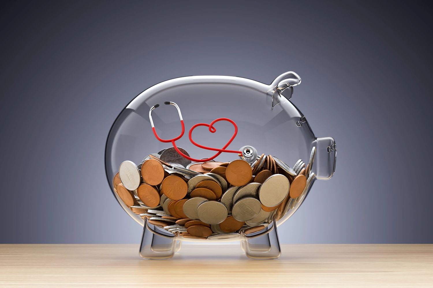 Glass piggy bank filled with coins and a stethoscope shaped like a heart.