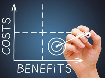 Hand drawing a cost-benefit analysis graph with target focus.
