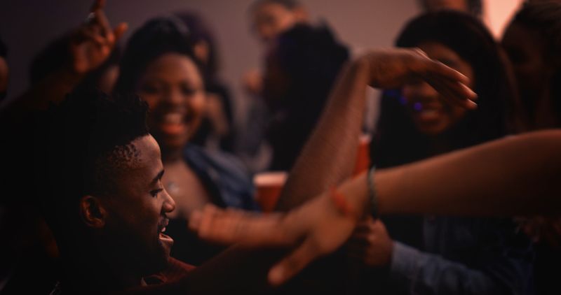 Cropped shot of a handsome young man dancing while partying with his friends in a nightclub