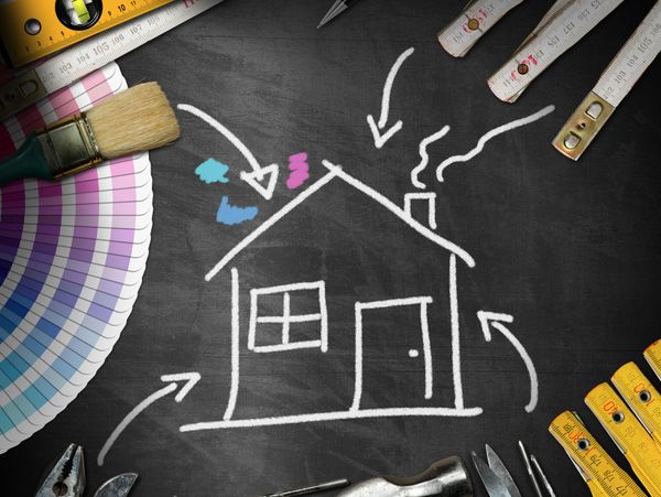 Chalk drawing of a house surrounded by painting and construction tools.