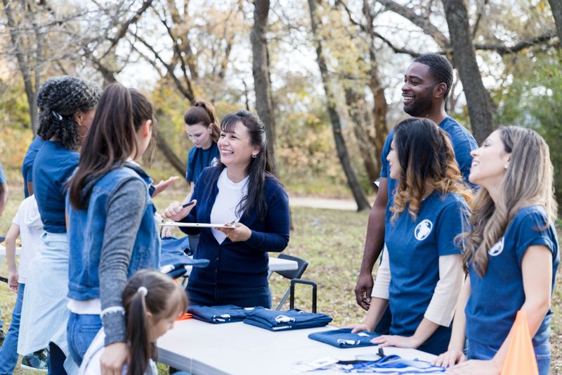 On a morning in autumn, a multi-ethnic group of volunteers gather to clean up their local park.
