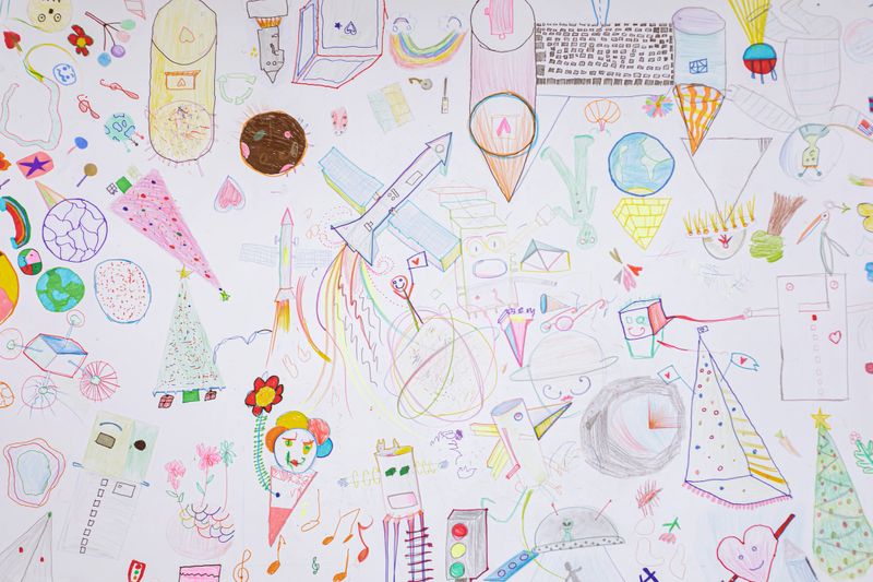 Colorful children's drawing (includes planet Earth, astronaut, Christmas tree, castle, plane, people, flowers, satellite)