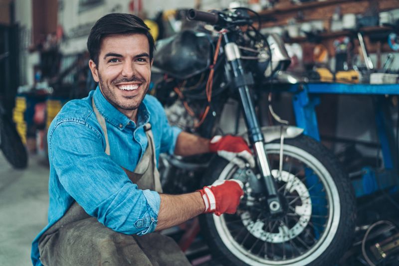 Mechanic repairing a motorcycle