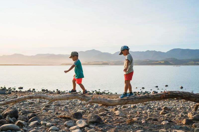 Kids enjoying outdoors at Lake Wairarapa, Wairarapa Region, New Zealand.