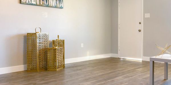 Minimalist corner with decorative gold lanterns and a California sign.