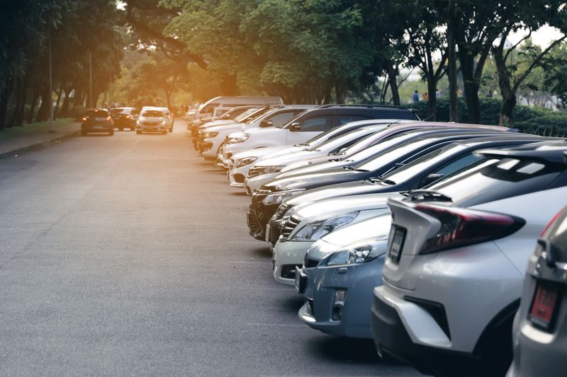 the cars in the parking lot on sunset background