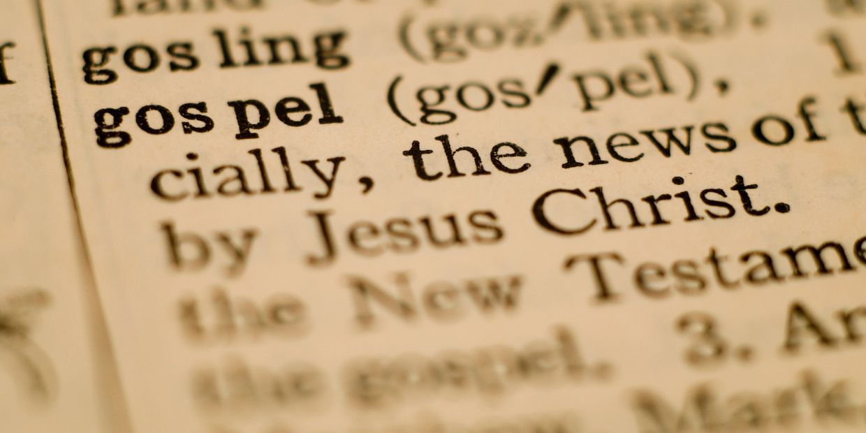 Close-up of the word "gospel" in a dictionary.