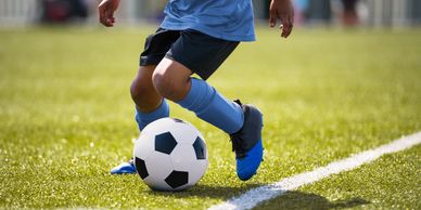 Child playing sports, sport related foot and ankle injuries. podiatrist treating fracture and sprain
