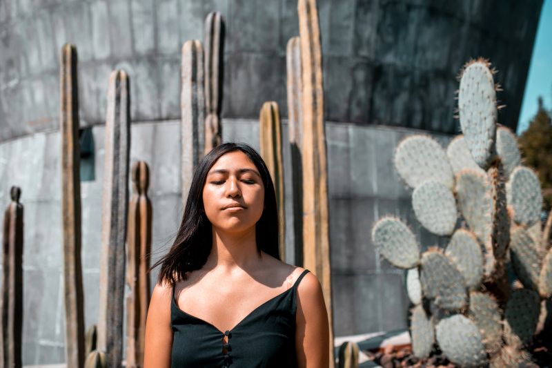 Portrait of a young woman with closed eyes enjoying the moment