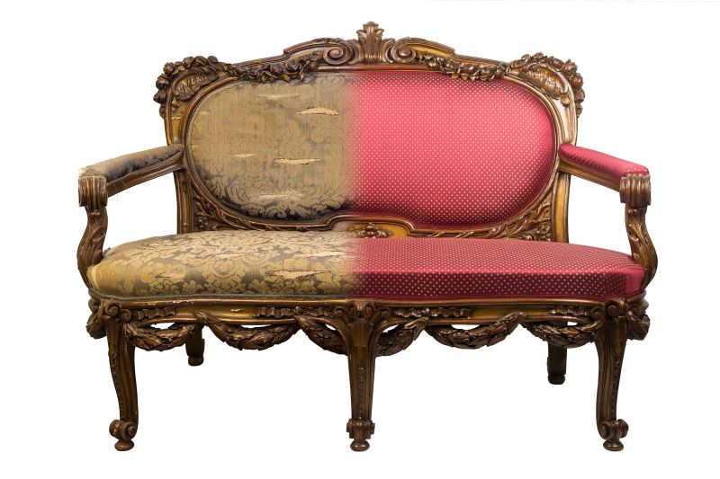 Antique vintage sofa with authentic fabric and wood carving and gilding before and after restoration , in a single photo