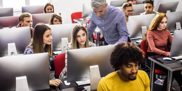 Students working on computers in a classroom.
