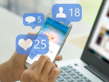 Person checking social media notifications on a smartphone.