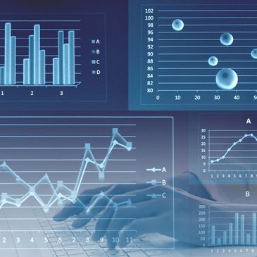 Overlay of business graphs and keyboard with hand.