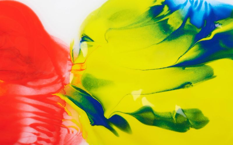 Abstract yellow and red paint background macro close up view