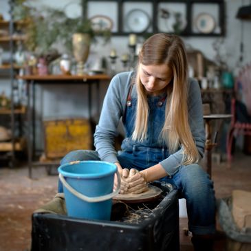 A woman distributing clay pots