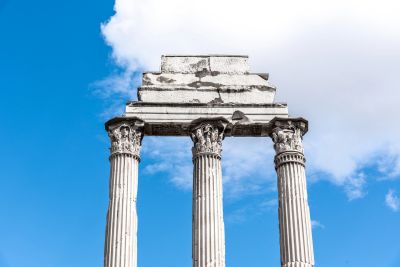 Ancient Greek temple columns against blue sky.