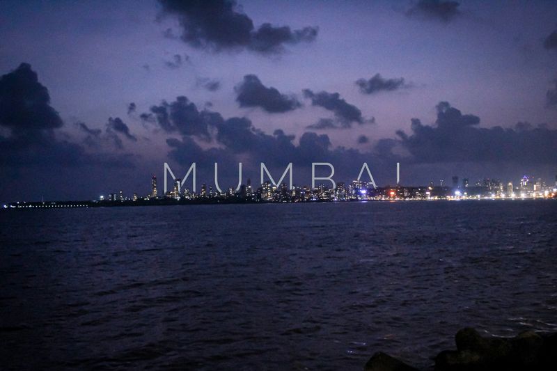 A view of Mumbai from the marine drive area in the night with glowing lights