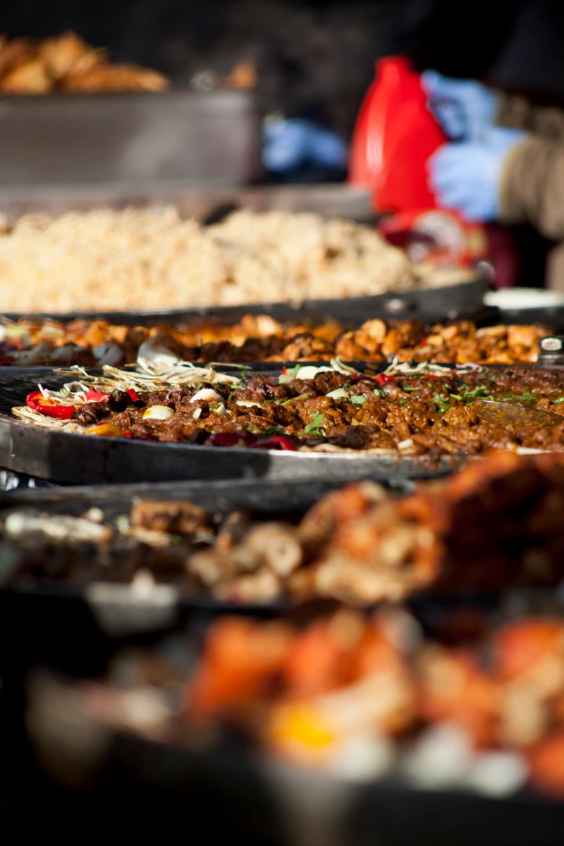 Pakistani cuisine Street food - rice, curry, kebab,  and bread selection.
