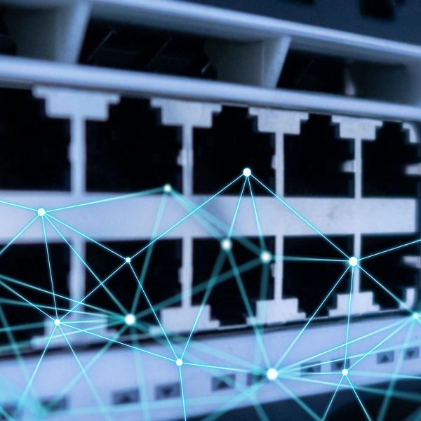 Close-up of network ports with digital connectivity overlay.