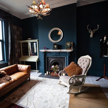 Carrara Marble Floor, Black Granite Tile, Hardwood Flooring, White Oak, Dark Blue Walls, Fireplace