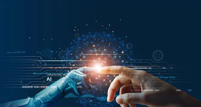 A human hand and a robot hand touching index finger, bringing human and AI together. 