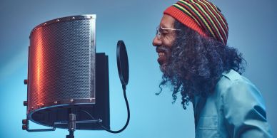 Man recording vocals in a studio.