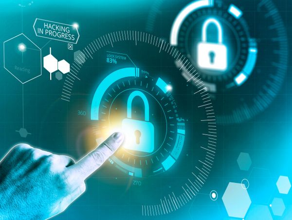 Finger interacting with digital lock symbol amid hacking warning and security interface.