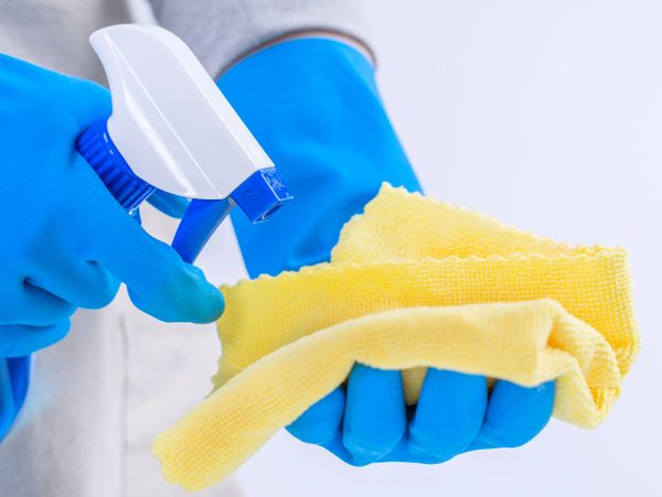 Spaying cleaning product into a cloth