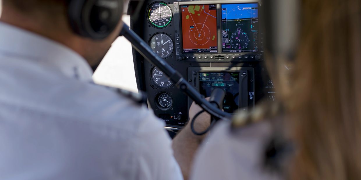 “CFI teaching student pilot during lesson at Forbes Aviation Academy.”