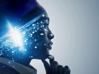 Profile of a person with a glowing brain effect.