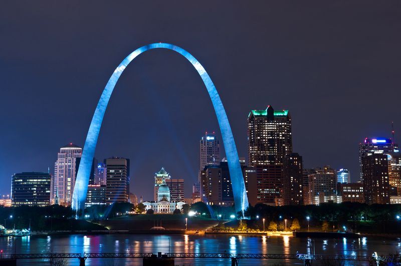 Image of St. Louis downtown with Gateway Arch at night.