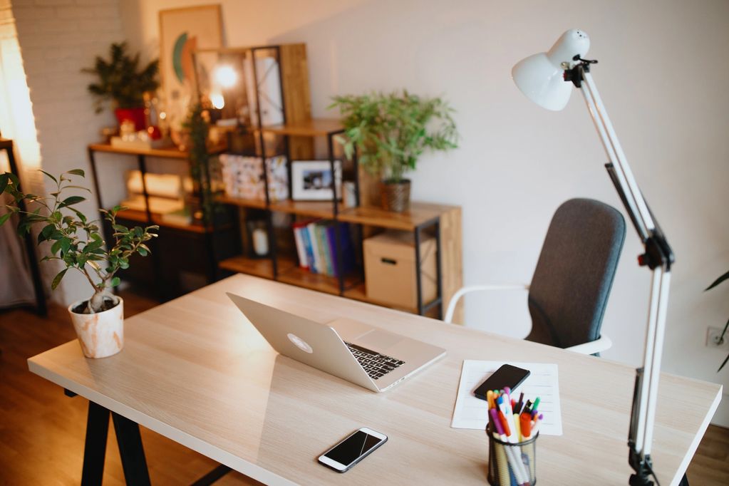 Home office in Your basement. desk with lamp and laptop.