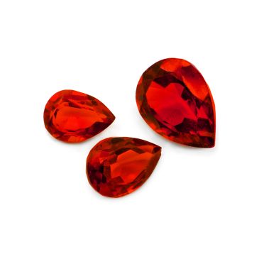 Three red pear-shaped gemstones.