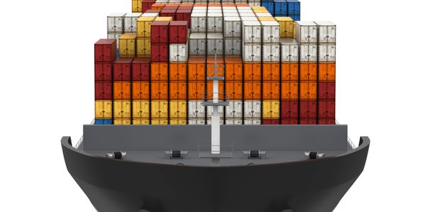 Front view of a cargo ship loaded with colorful shipping containers.