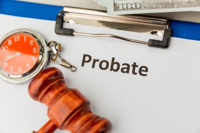 Probate document with gavel and pocket watch.