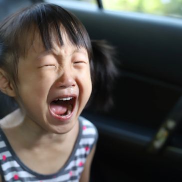 A young child crying intensely.