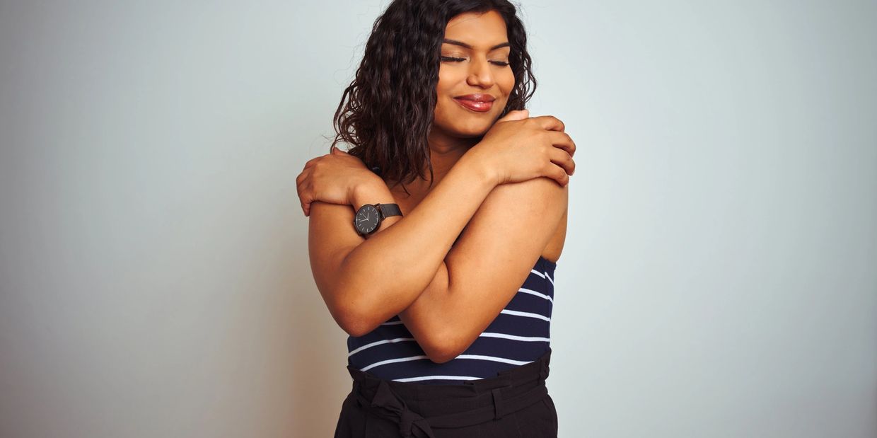 Someone hugging themselves