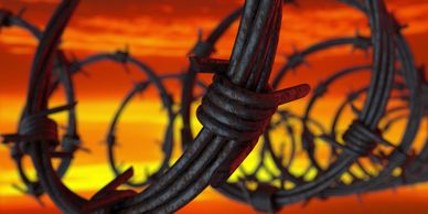 Barbed wire fence to keep bad guys out and good guys safe 