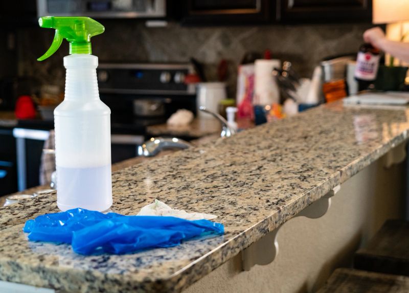 Spray bottle and protective gloves , cleaning Wiping Down Surfaces for Covid-19 or Coronavirus