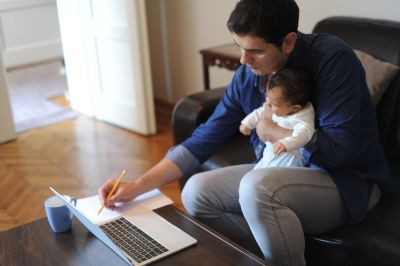 Father holding his infant child, representing paternity, fathers' rights, and parent-child relations