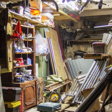 Cluttered workshop filled with tools and materials.