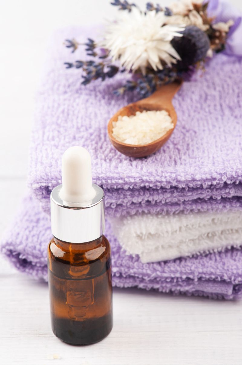 Essential oil, bath salt in SPA arrengement with dry flowers and towels