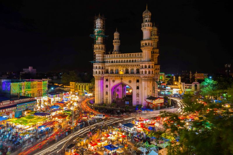 Long Exposure Shot of Traffic moving around Charminar during ramadan season on the night of eid in hyderabad, india.