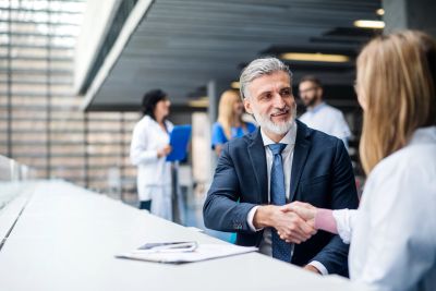 Businessman shaking hands with a doctor.
